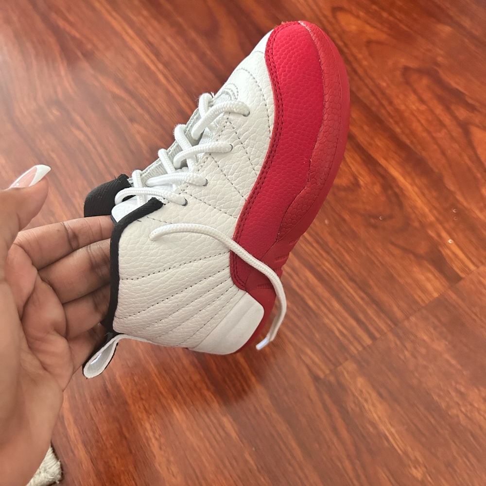Jordan 12. 9c. Red , white , and black.